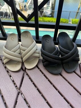 Pair of OluKai Hila Crisscross Slide Sandals in Cream and Black
